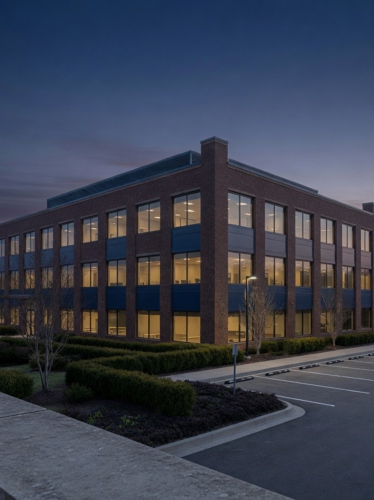 Finished brick commercial building at dusk — the kind of work Keyz 2 Construction delivers